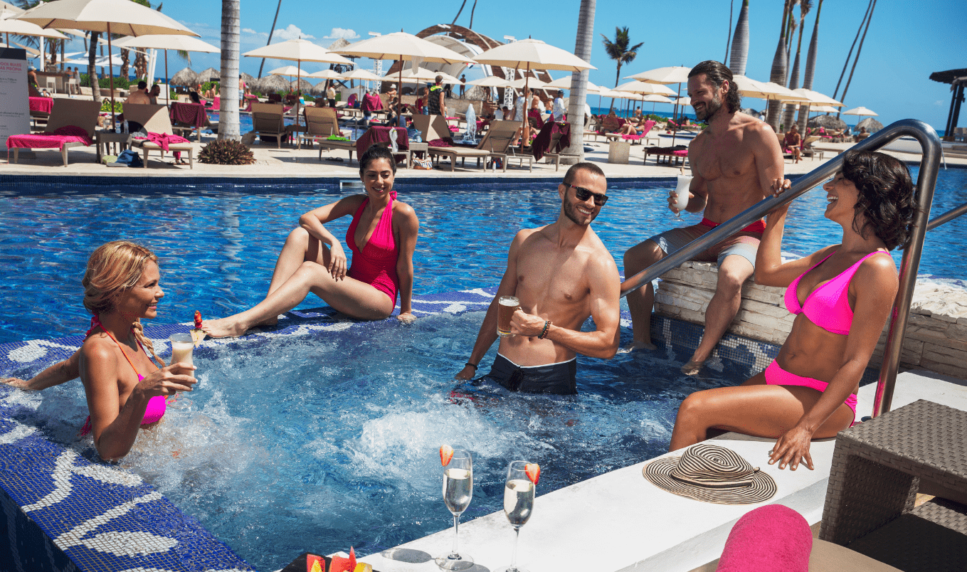 a group of people sitting in a pool
