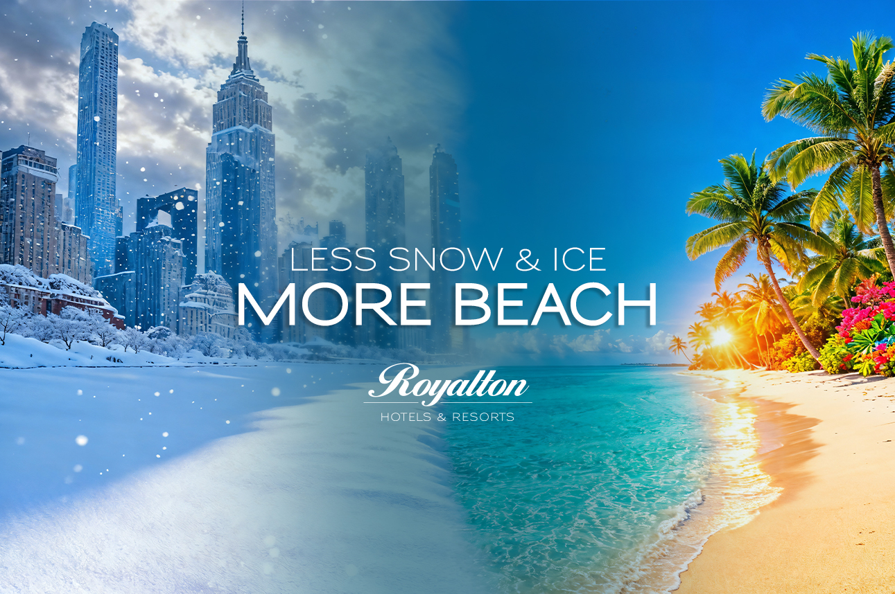 a beach with palm trees and buildings