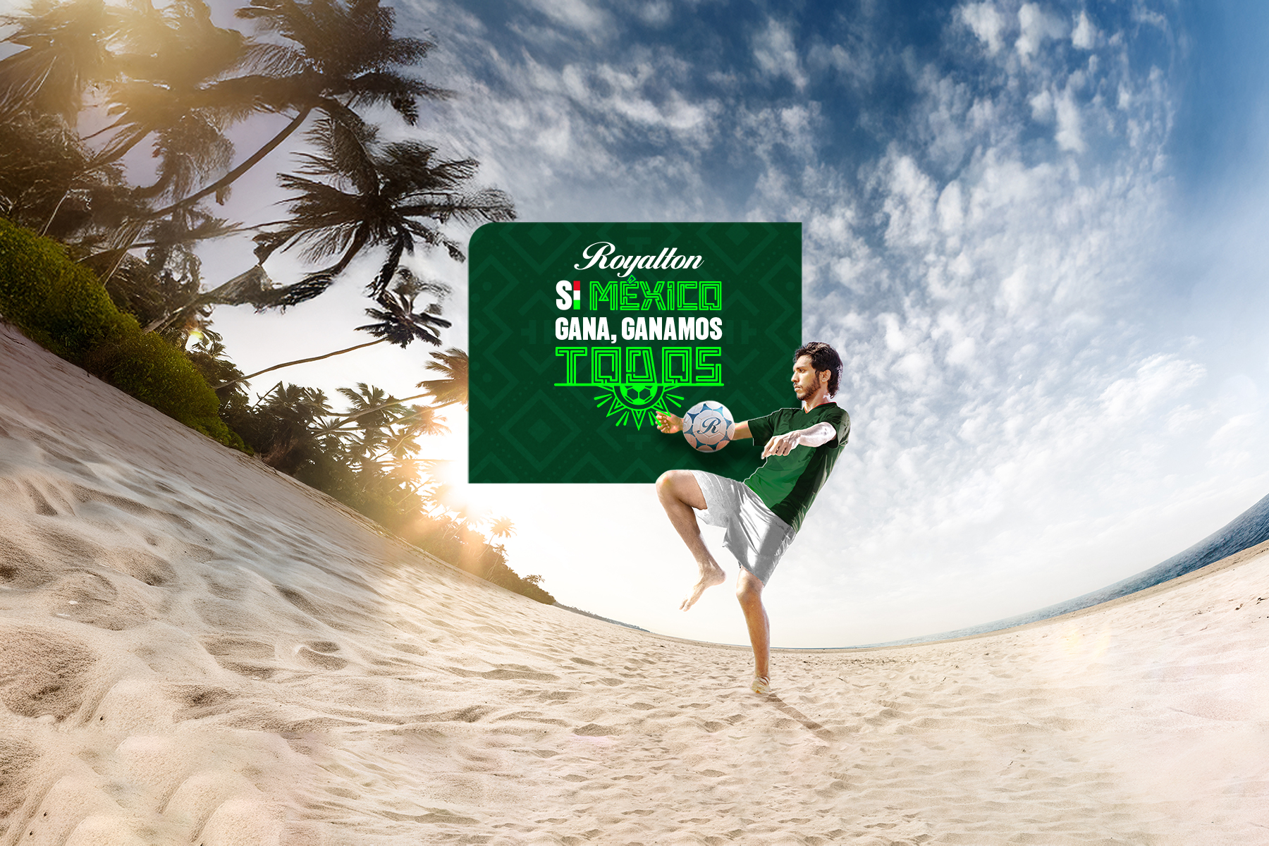 a man holding a football ball on a beach