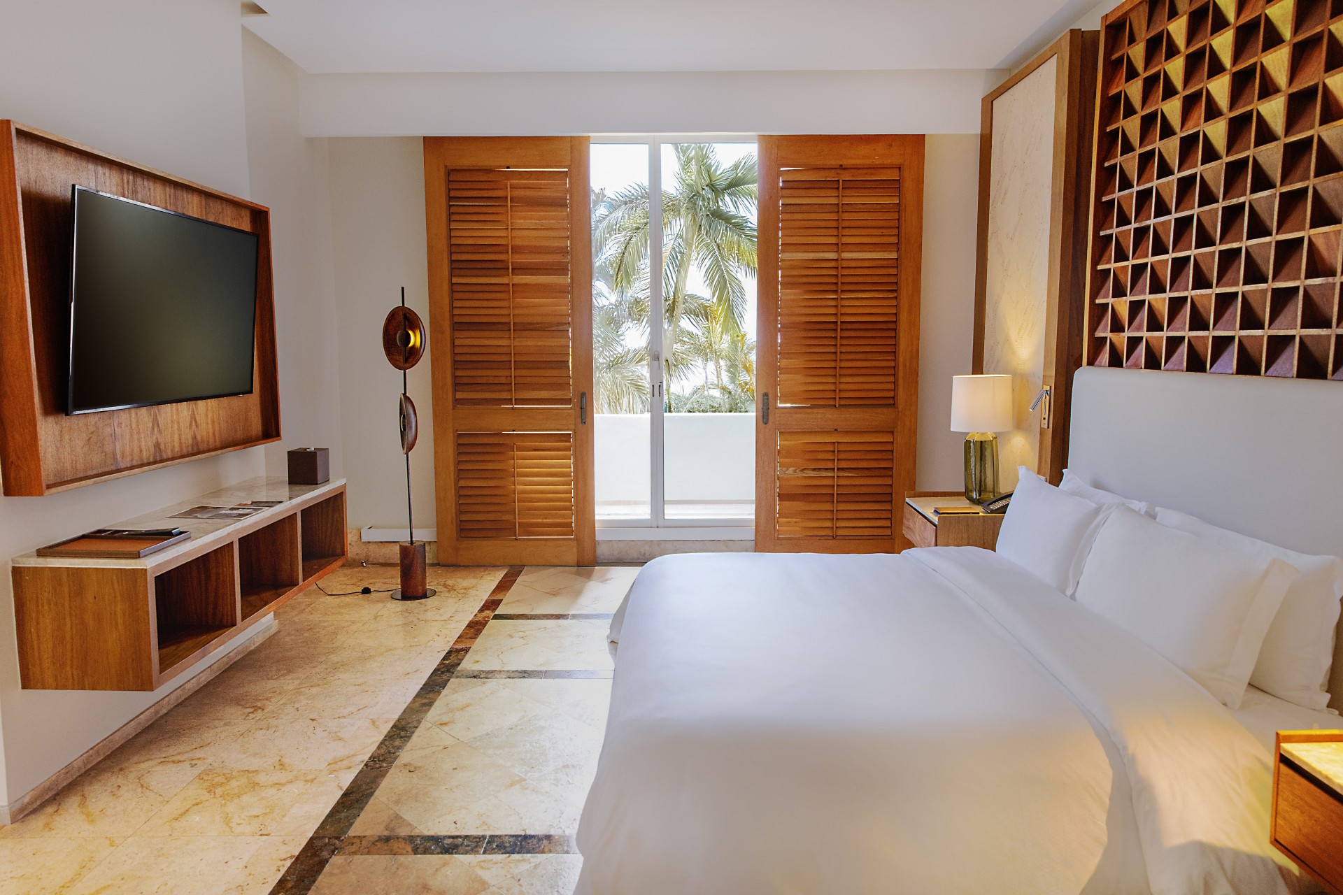 a bedroom with a television and a bed