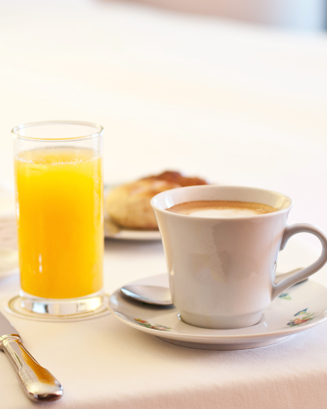 a cup of coffee and a glass of orange juice