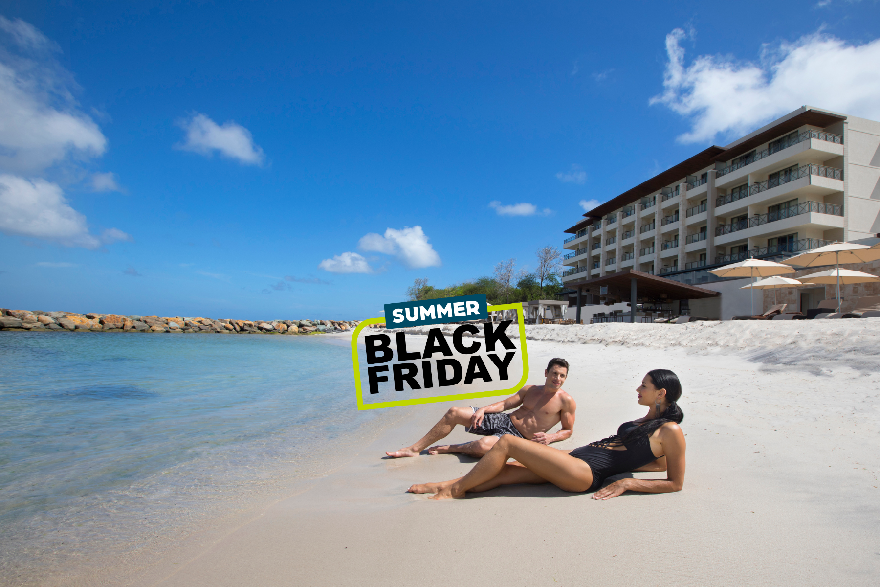 a man and woman lying on a beach