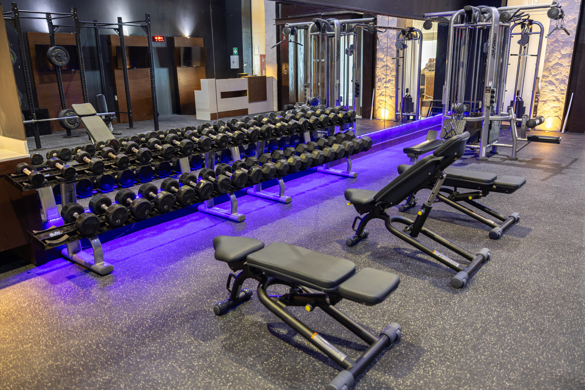 a gym with weights and equipment