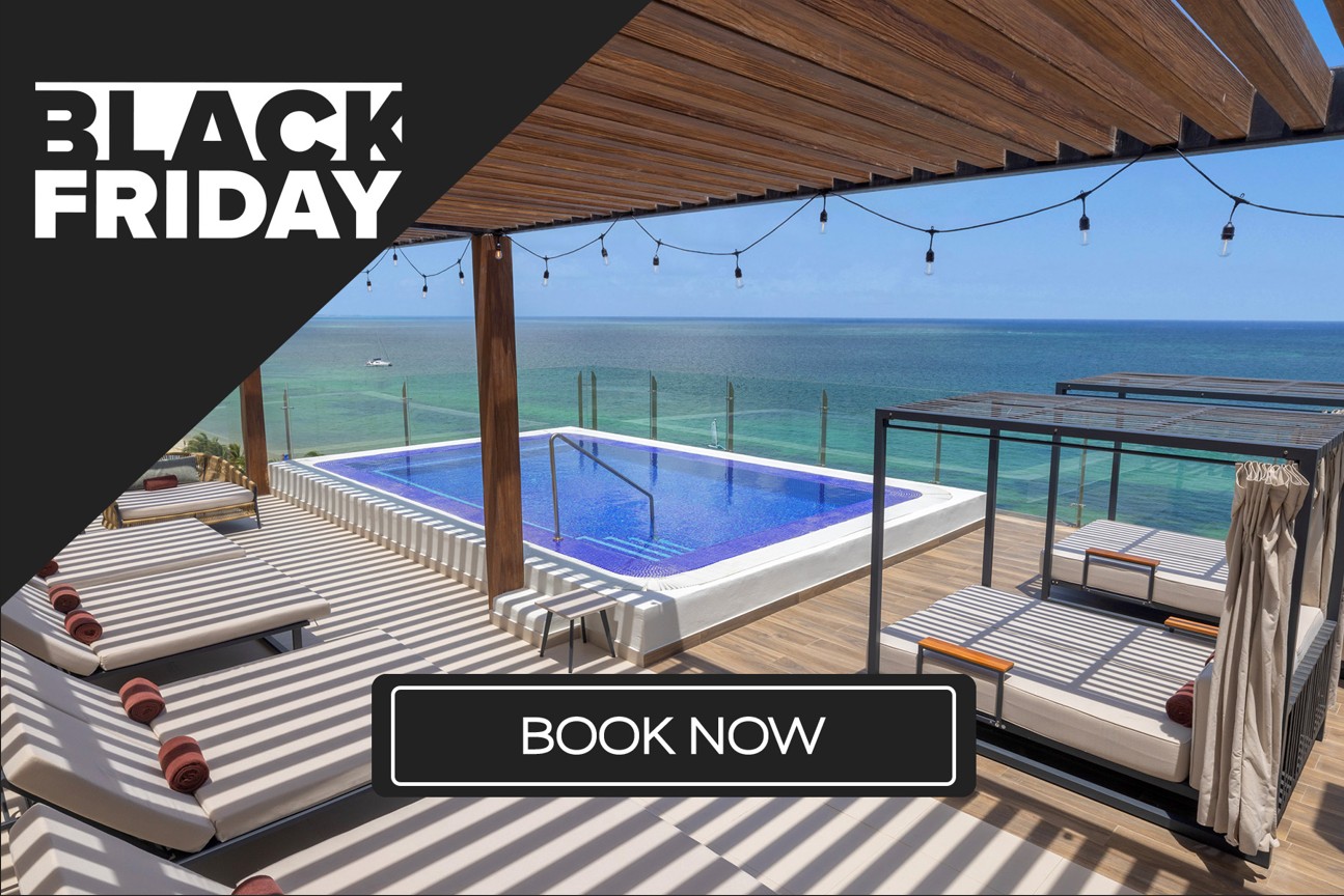 a pool with a deck and chairs on a deck with a pool in the background