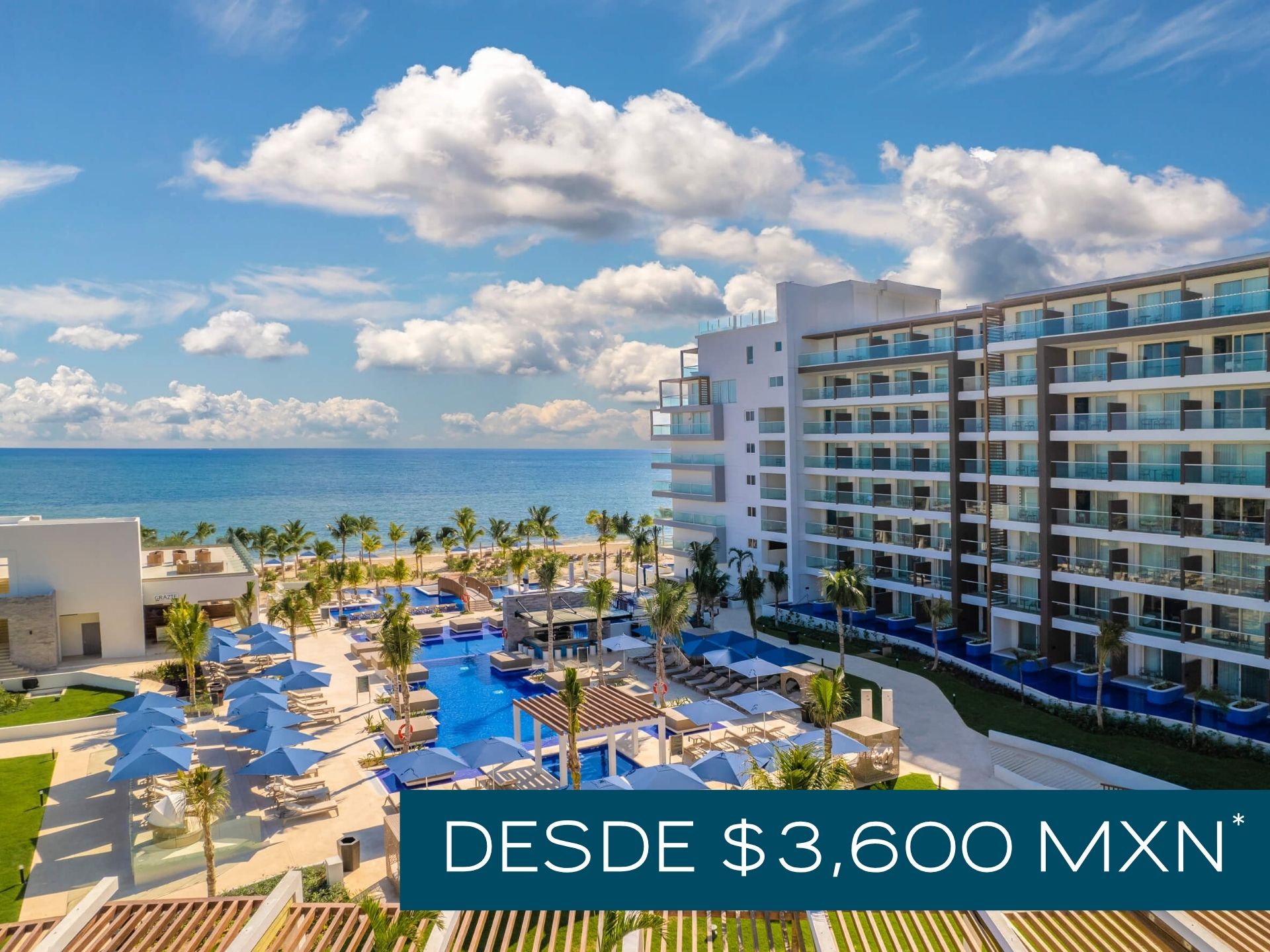 a hotel with a pool and umbrellas