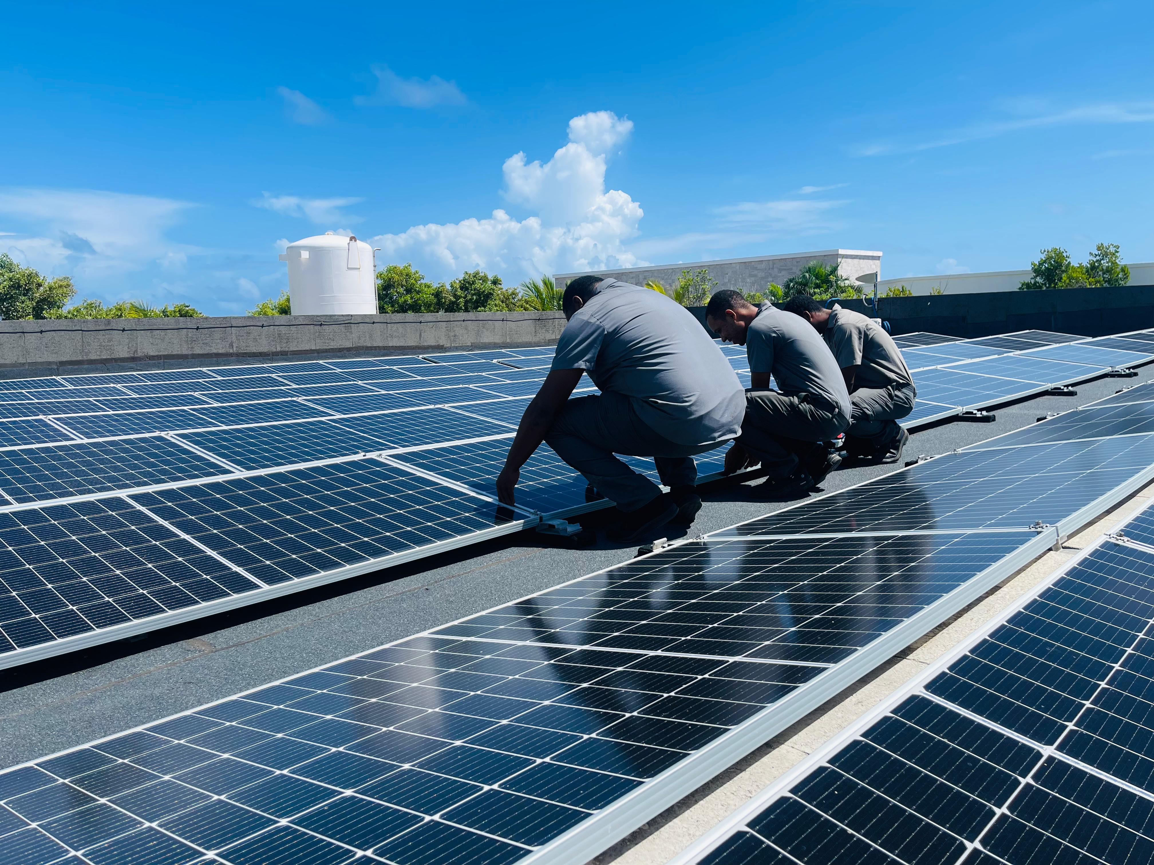 a group of men working on solar panels