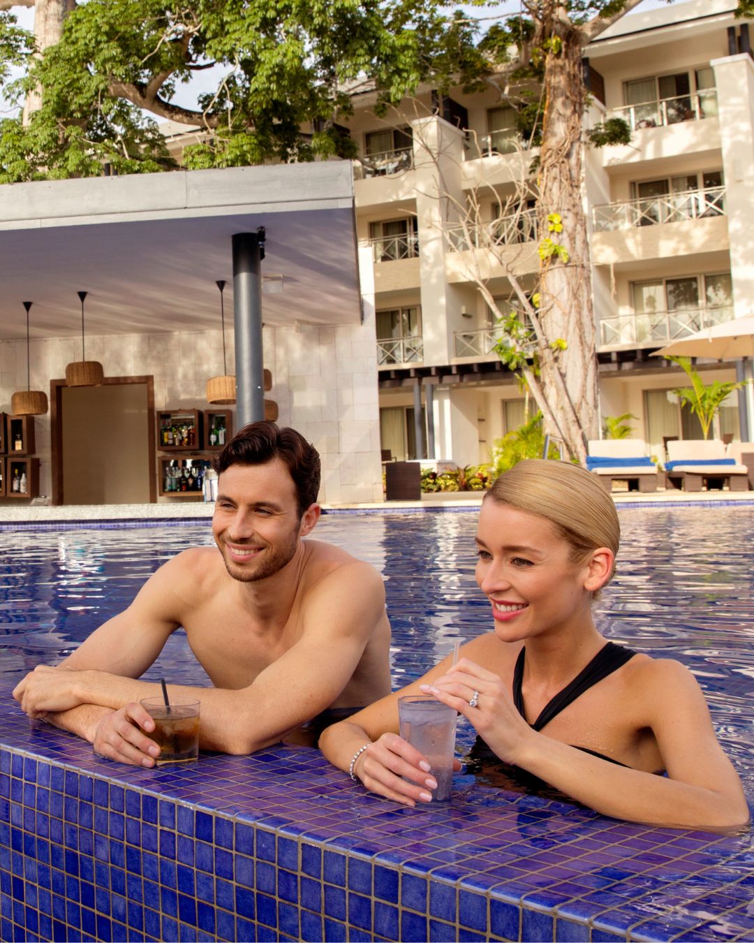 a man and woman in a pool