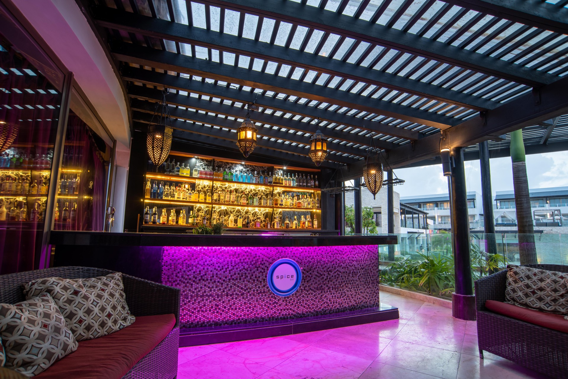 a bar with a purple and pink lighting