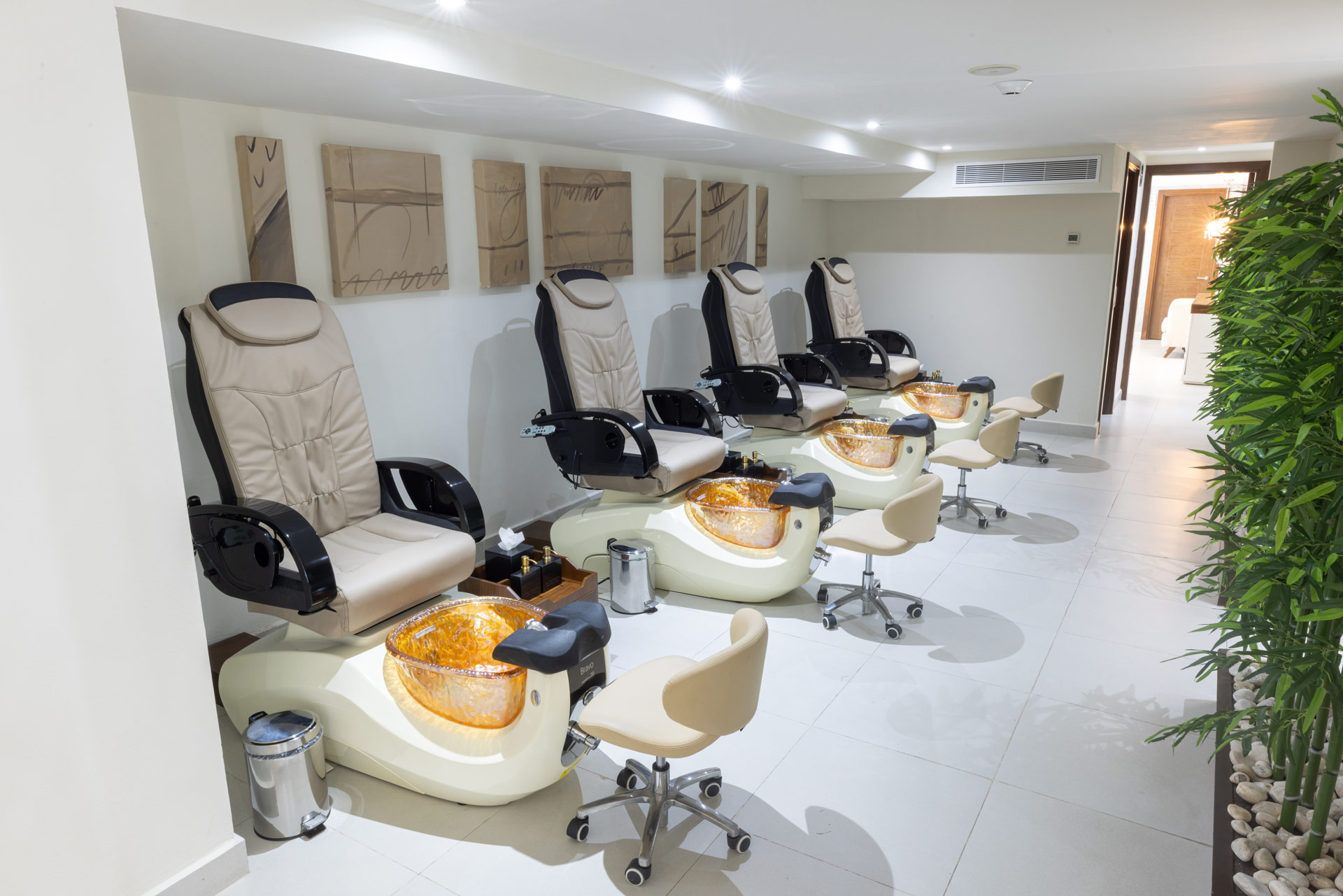 a room with chairs and art on the wall