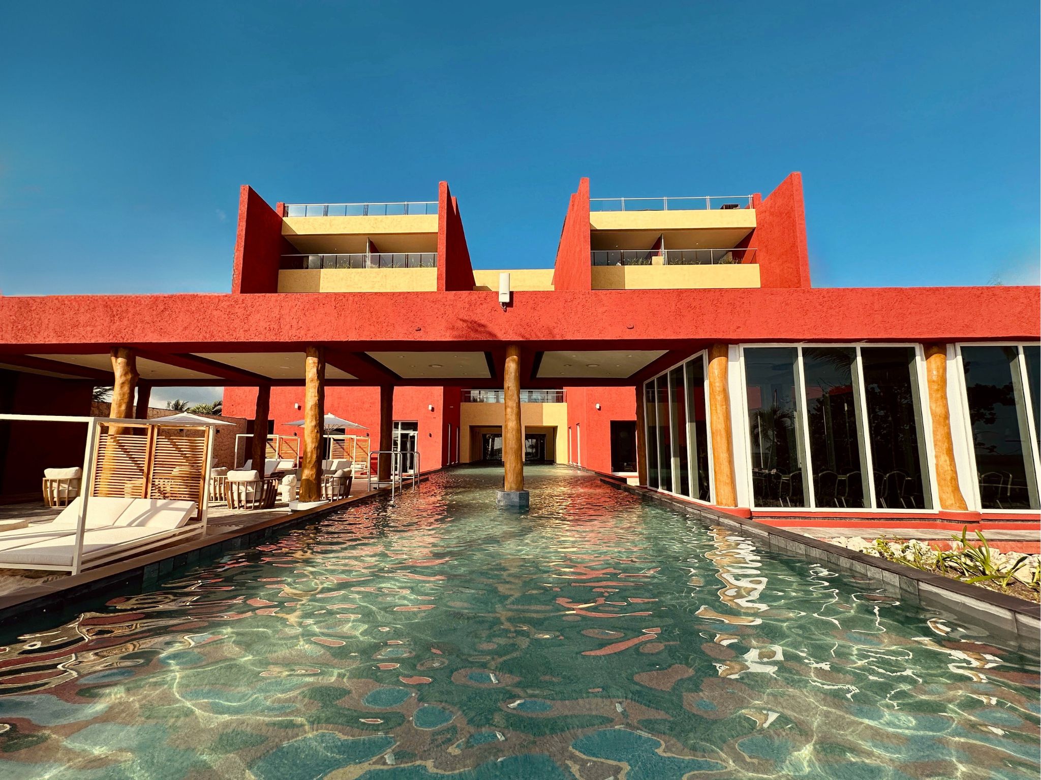 a pool of water next to a building