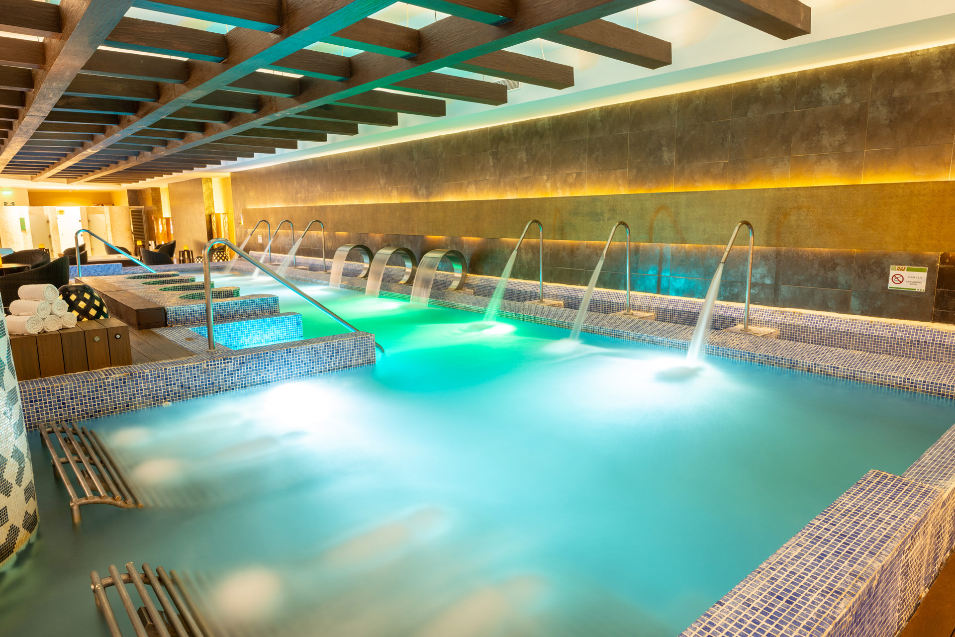a pool with water and a couple of people in it