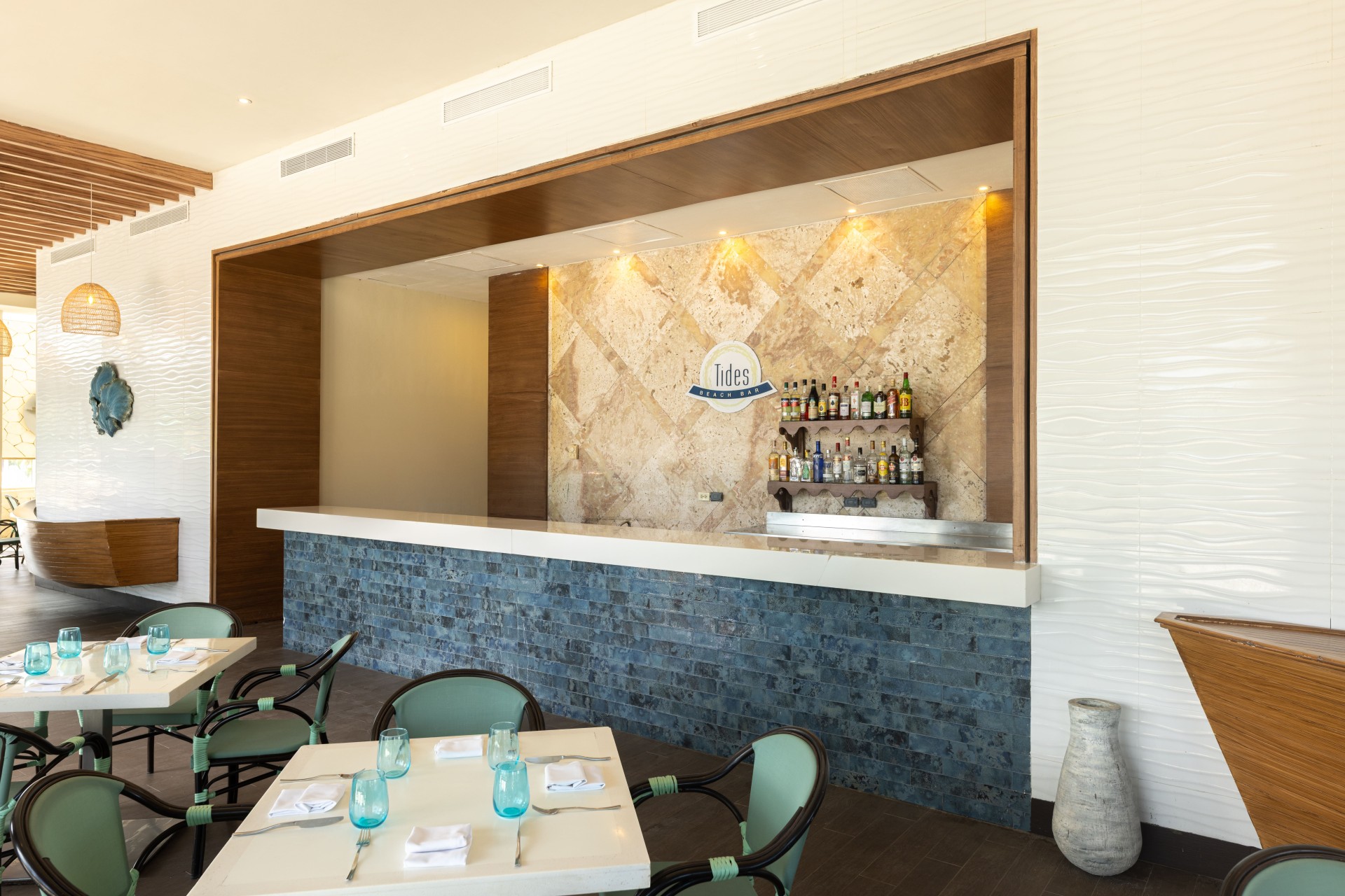 a bar with a counter and chairs