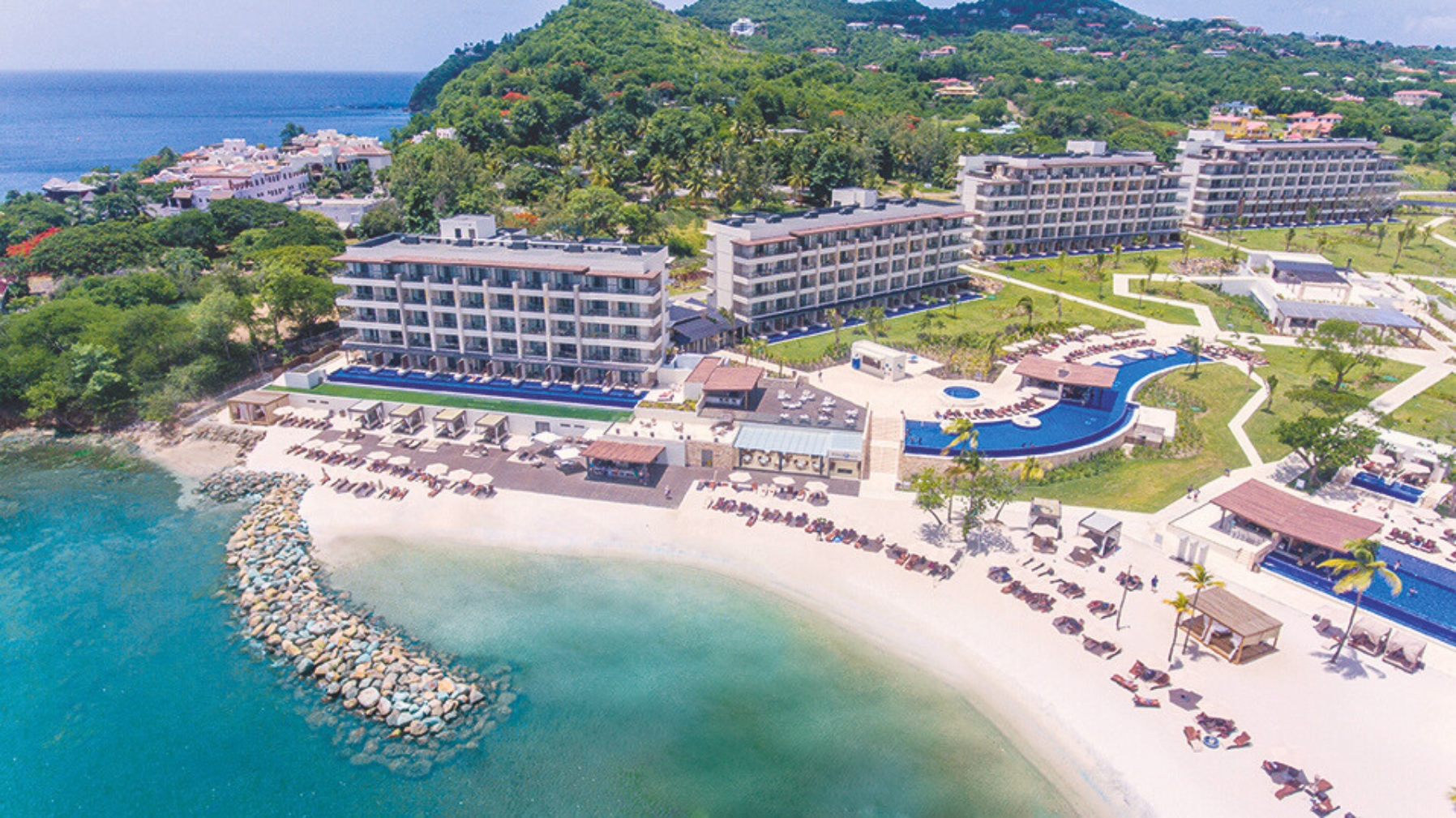a resort with a pool and a beach