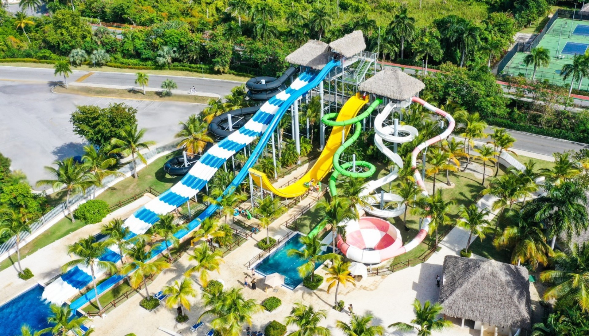 a water park with a slide and a pool