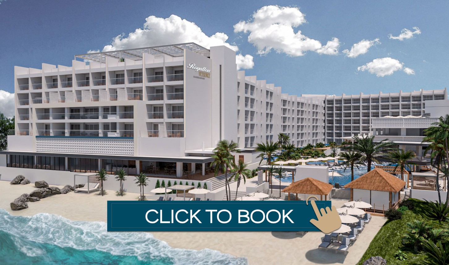 a hotel with a beach and palm trees