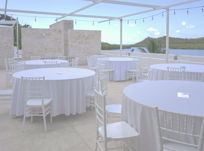 a group of tables and chairs on a patio
