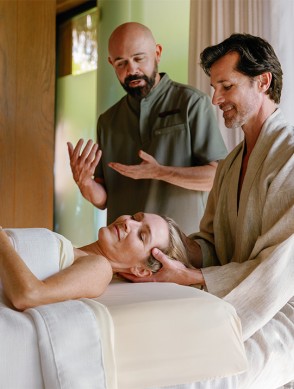 a man and woman lying on a bed