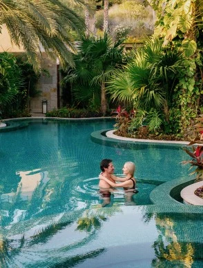 a man and woman in a pool