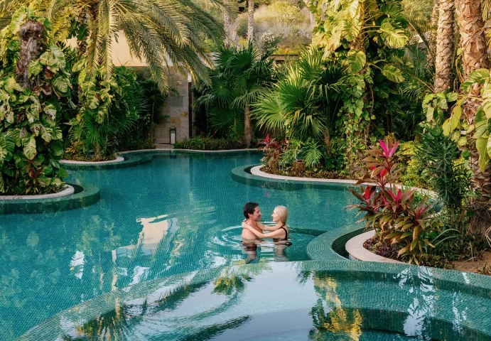 a man and woman in a pool