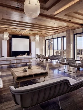 a room with a large screen and chairs