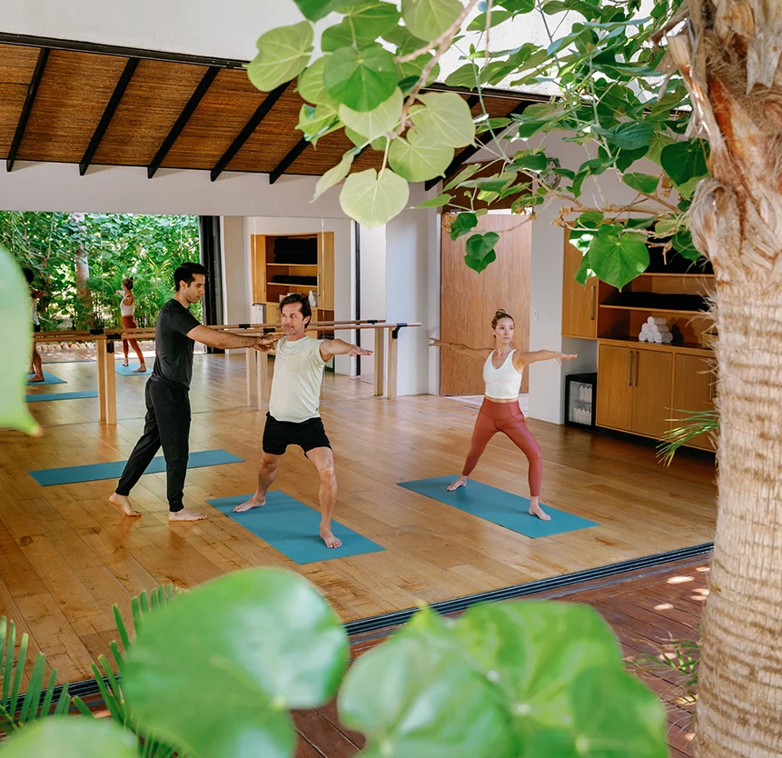 people doing yoga in a room