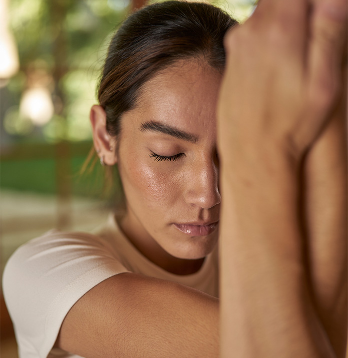 a woman with her eyes closed