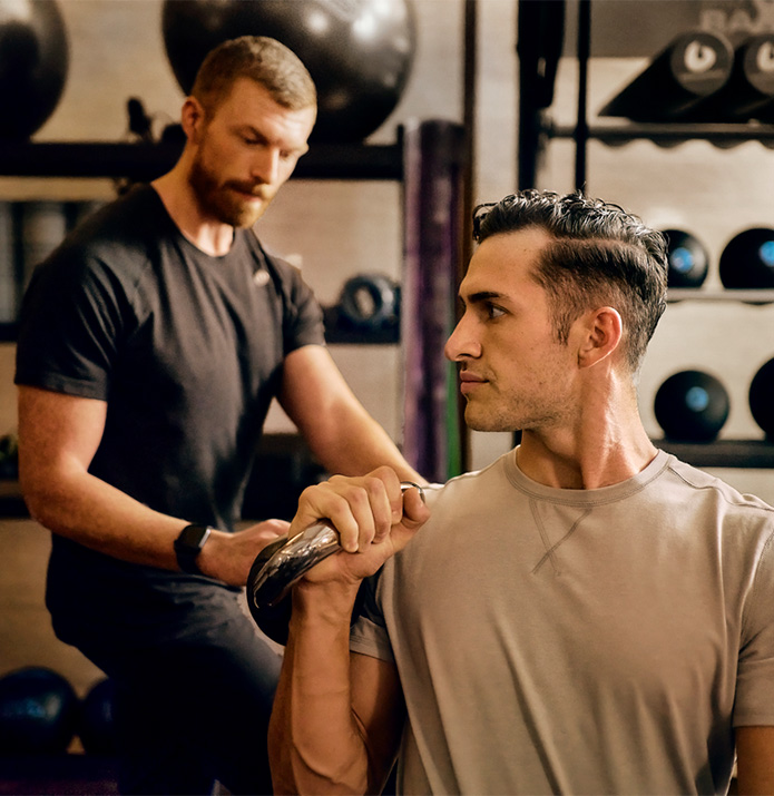 a man lifting weights in a gym
