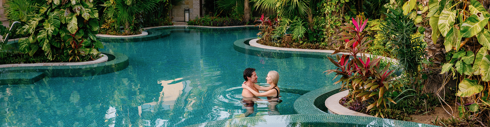 a man and woman in a pool