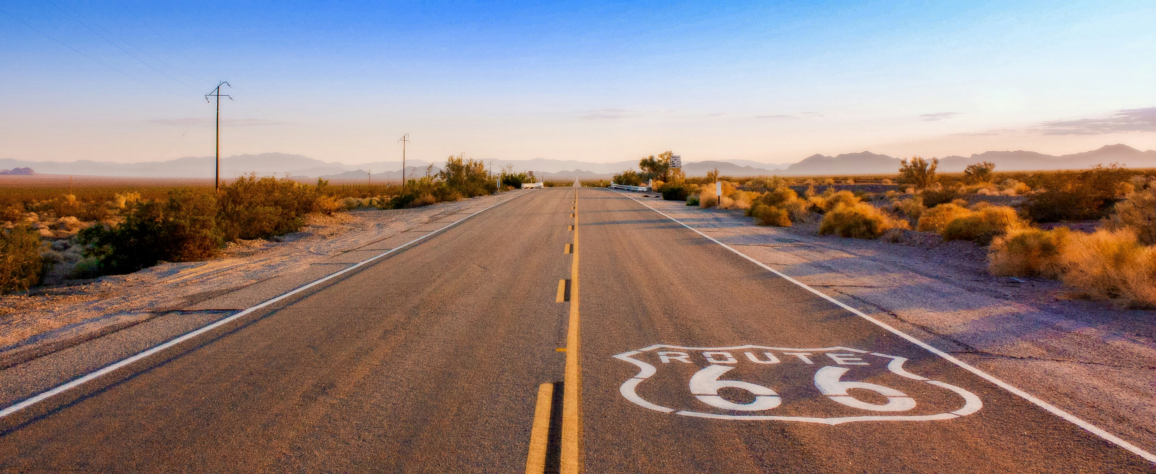 a road with a sign painted on it