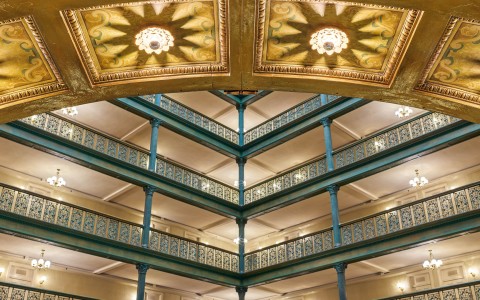 a building with a balcony and lights