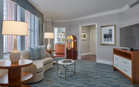 a living room with a couch and a jukebox