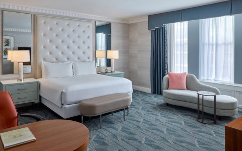 a room with a bed and a chair