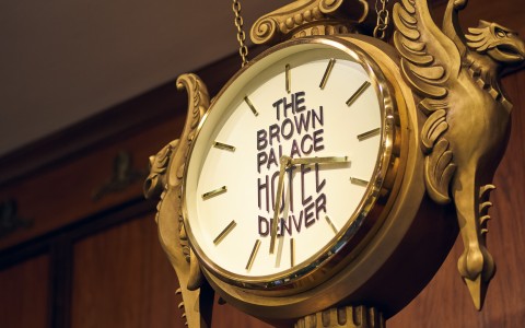 a clock with a gold frame