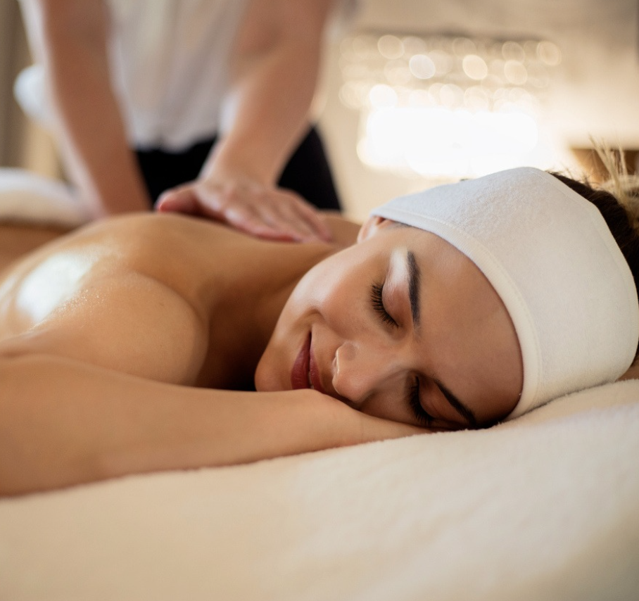 a woman lying down on a massage table