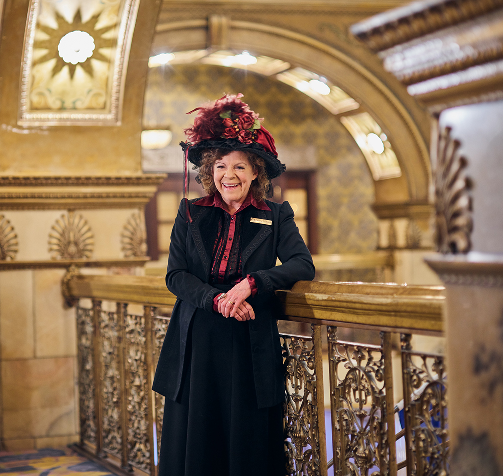 a woman in a hat and dress