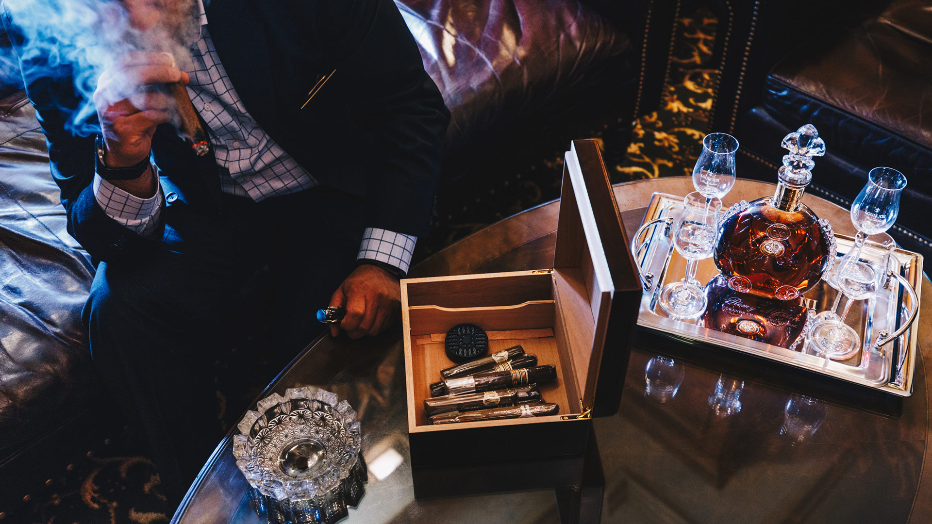 a man holding a cigar box