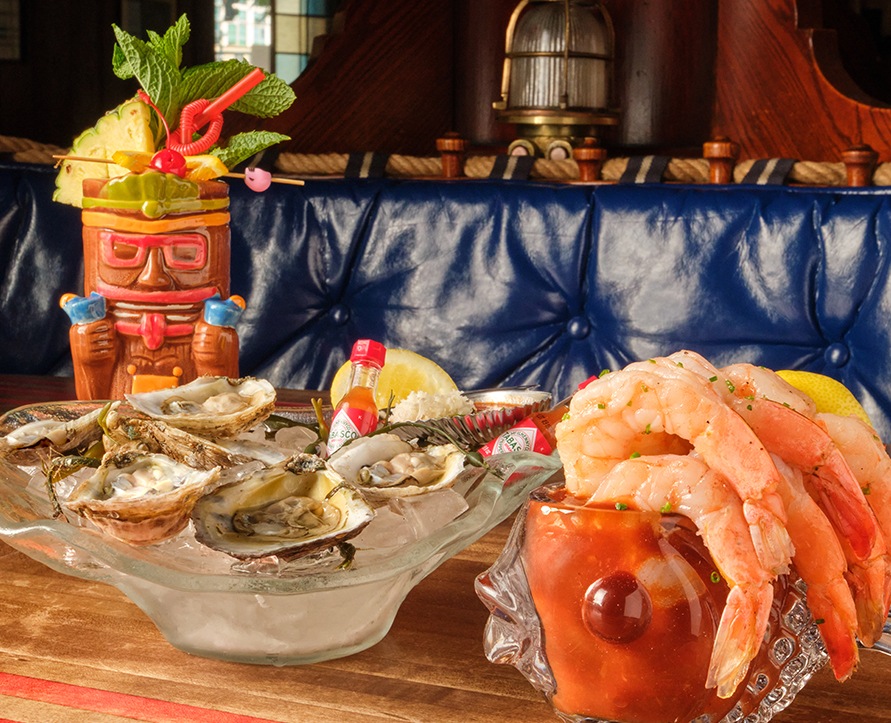 a plate of seafood and a cocktail on a table