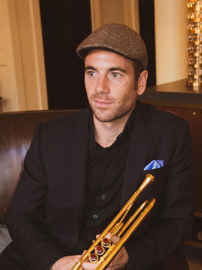 a man holding a trumpet