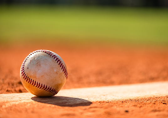 a baseball on a dirt field