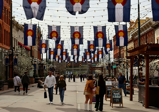 a street with flags from the ceiling