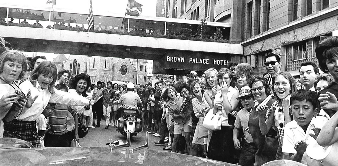 a group of people standing in a crowd