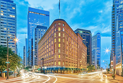 a city street with a large building