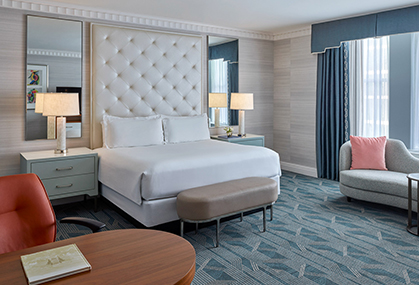 a room with a bed and a chair