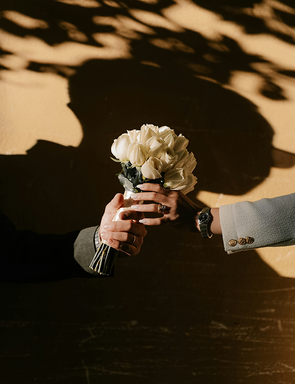 a person holding a bouquet of flowers