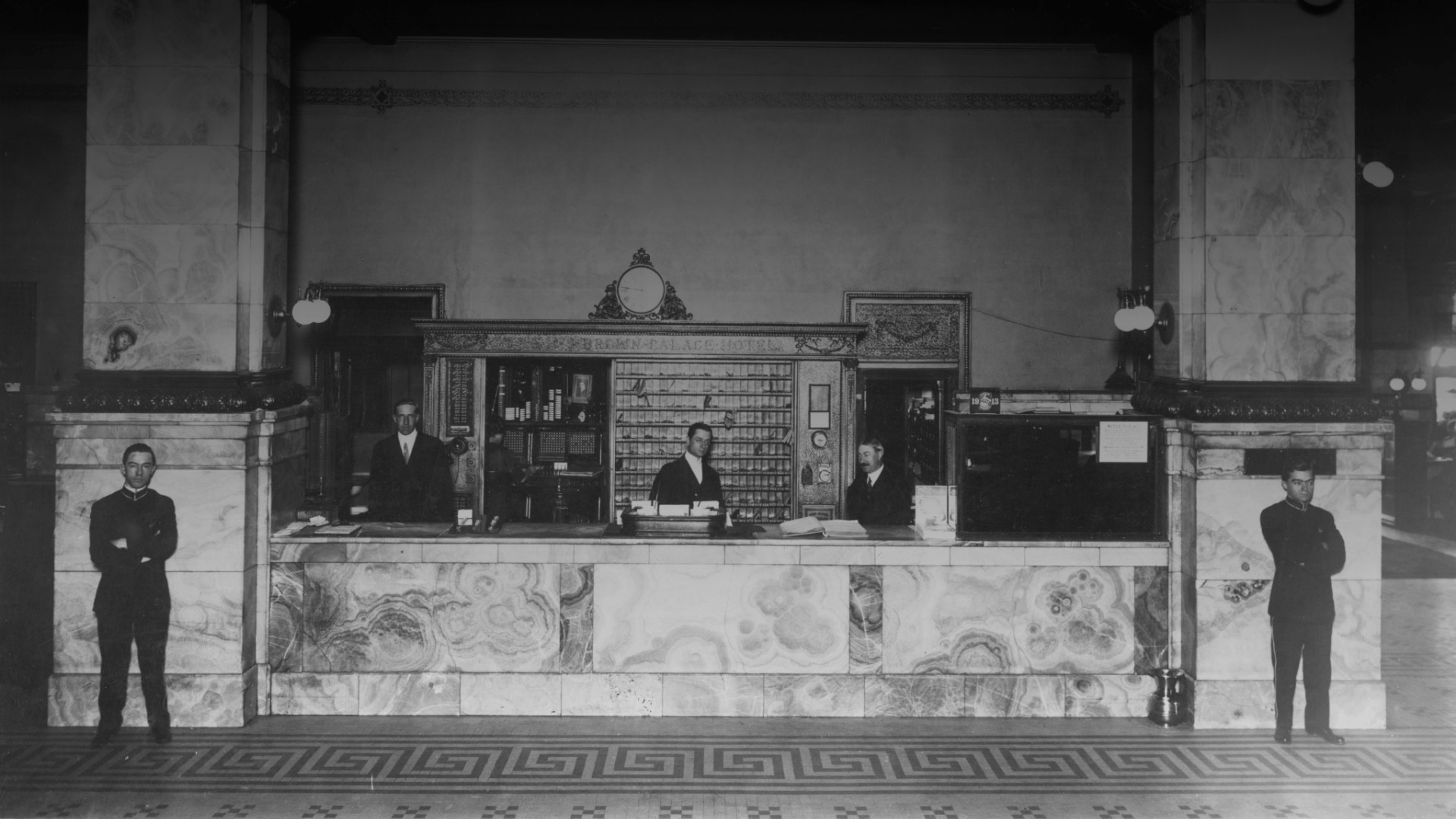 a group of men standing at a counter