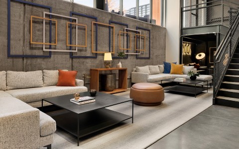 a room with couches and coffee tables