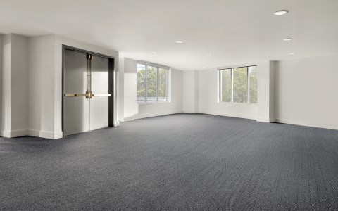 a room with a door and windows