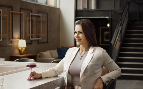 a woman sitting at a bar