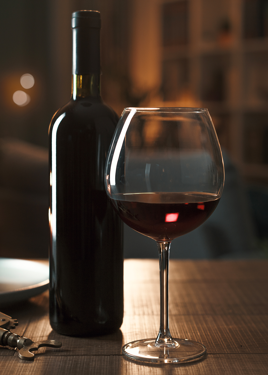 a bottle of wine and a glass of wine