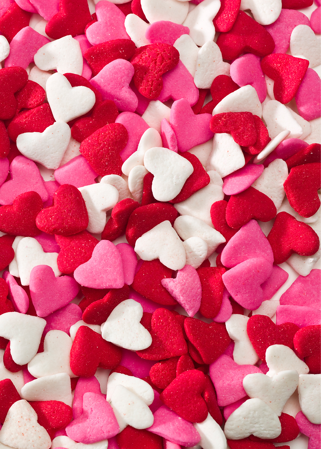 a pile of heart shaped candies